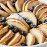 Blueberry Buttermilk Pancake Bake in a casserole dish with golden crumb topping