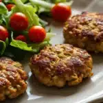Homemade ground chicken patties served with salad
