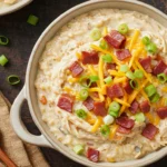 Slow Cooker Cheesy Ranch Chicken served hot with melted cheese and bacon