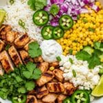 street corn chicken rice bowl in rustic bowl