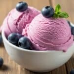 Homemade blueberry ice cream with fresh berries