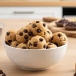 Homemade cookie dough bites with mini chocolate chips in a bowl