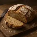 Oat flour bread sliced on a cutting board