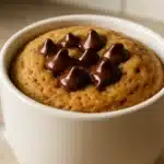 Peanut Butter Mug Cake fresh from microwave in a white mug