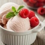 Homemade raspberry ice cream with fresh raspberries