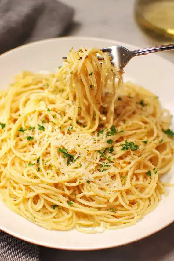 Freshly prepared brown butter spaghetti with mizithra cheese in a pan