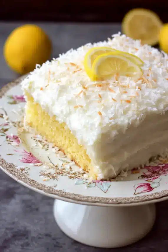 Lemon cake with coconut frosting showing texture and layers