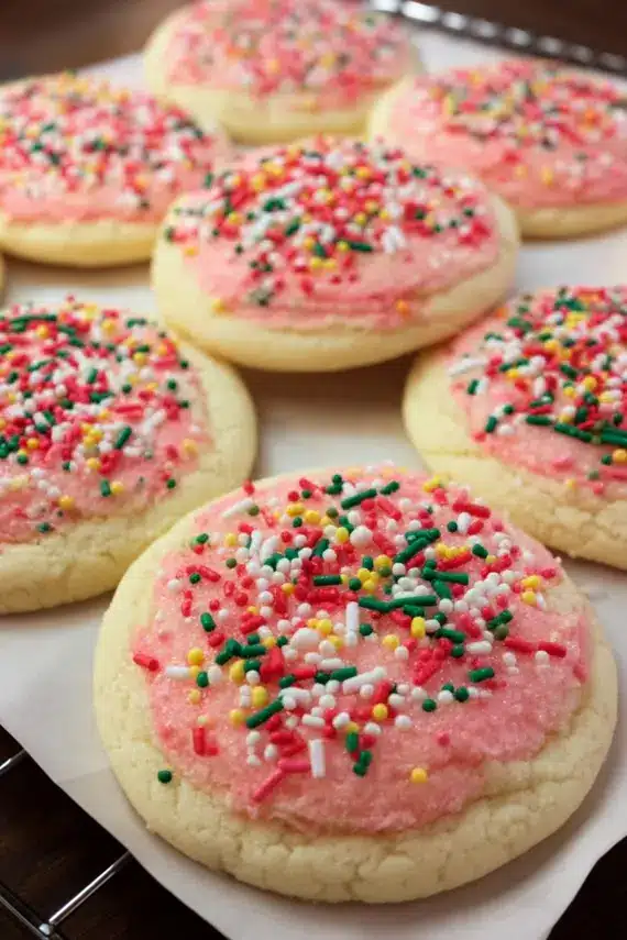 Copycat lofthouse sugar cookies with colorful frosting and sprinkles on a cooling rack