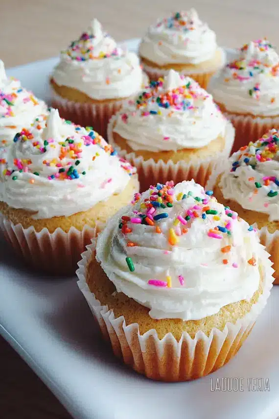 Beautifully frosted birthday cupcakes with colorful sprinkles
