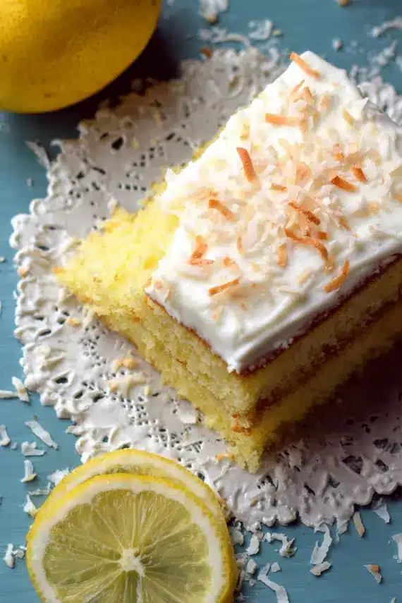 Close-up of lemon cake with coconut frosting showing texture detail