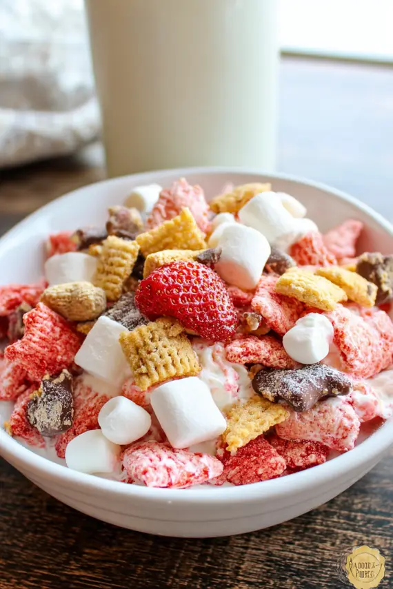 Strawberry Shortcake Muddy Buddies displayed in decorative serving dishes