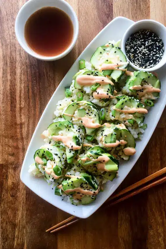 California Roll Cucumber Salad served in individual portions with chopsticks and garnishes