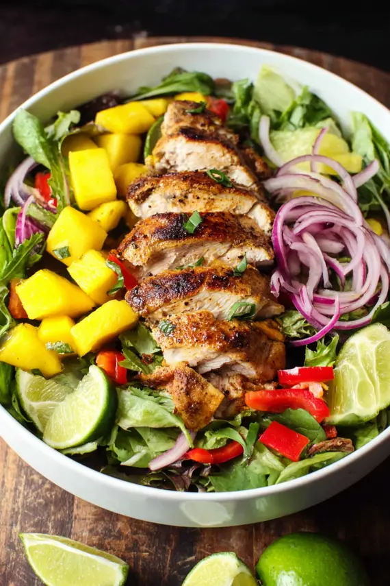 Tropical chicken salad with colorful ingredients and jerk seasoning