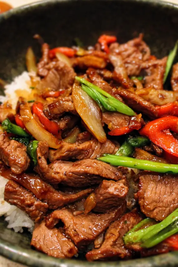 Delicious Asian BBQ Beef Stir Fry with colorful vegetables and glossy sauce in a wok