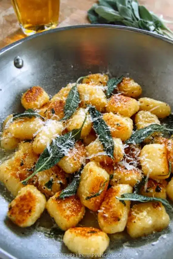 Delicious brown butter gnocchi with crispy sage leaves in a skillet