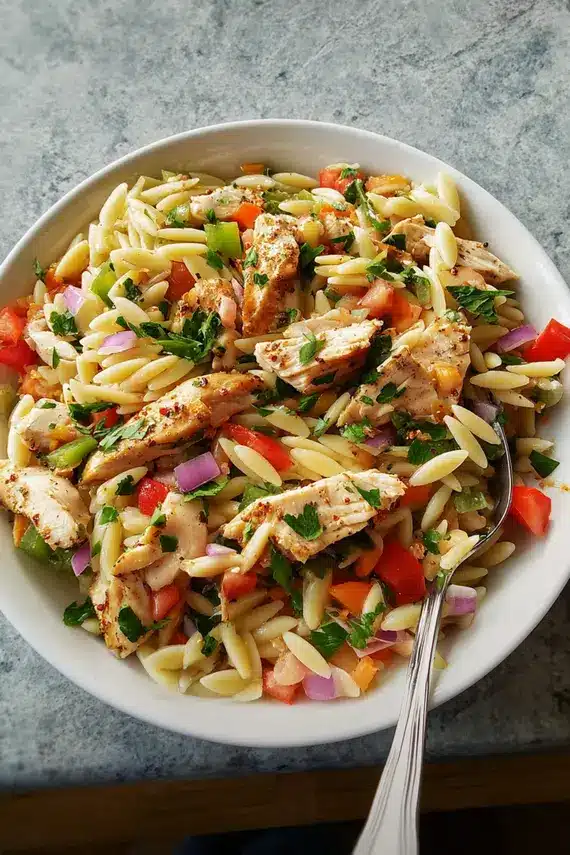 Cajun Chicken Orzo Salad with vibrant vegetables and herbs