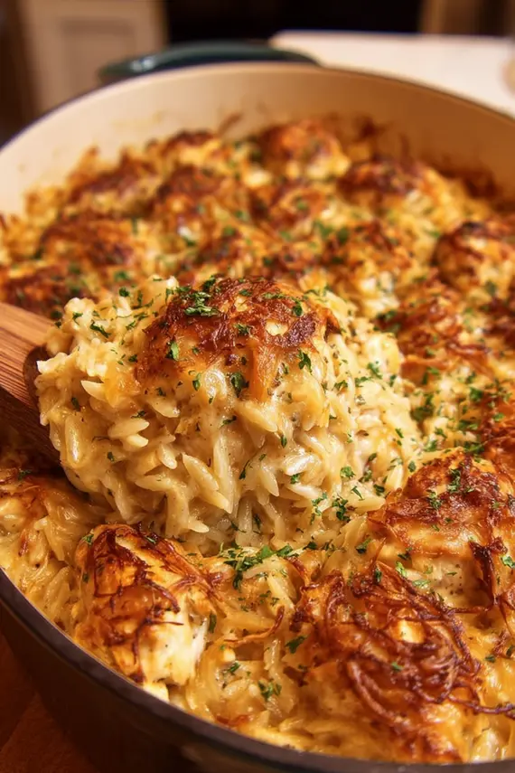 Close-up of golden caramelized onions in a skillet for Chicken Orzo Bake