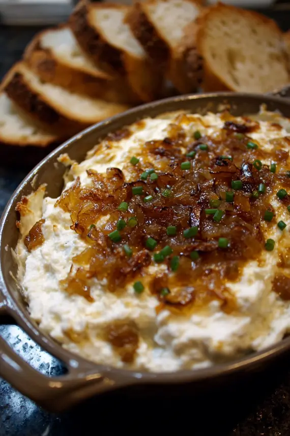 Caramelized onions cooking in a skillet, showing golden brown color