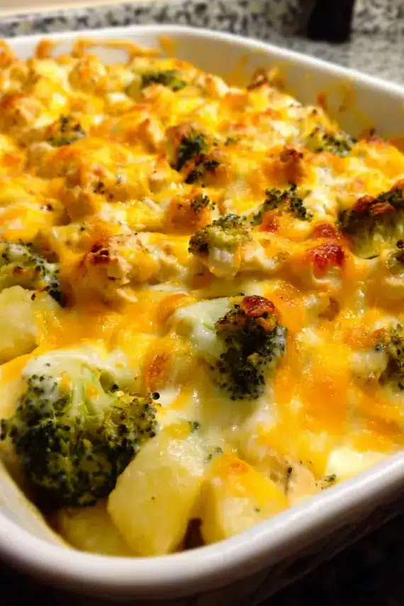 Cheesy Chicken Broccoli Potato Casserole served on a plate with side salad