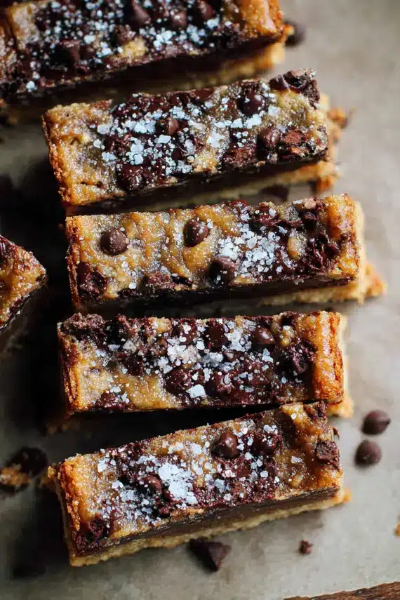 Close up of sliced Cookie Butter Chocolate Bars on a wooden serving board