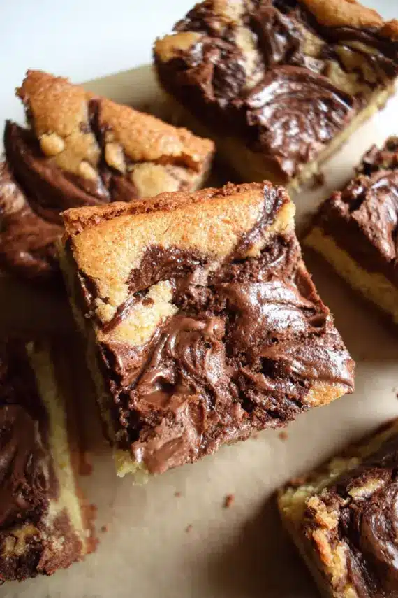 Freshly baked chocolate hazelnut brownies with a perfect crackly top and fudgy center