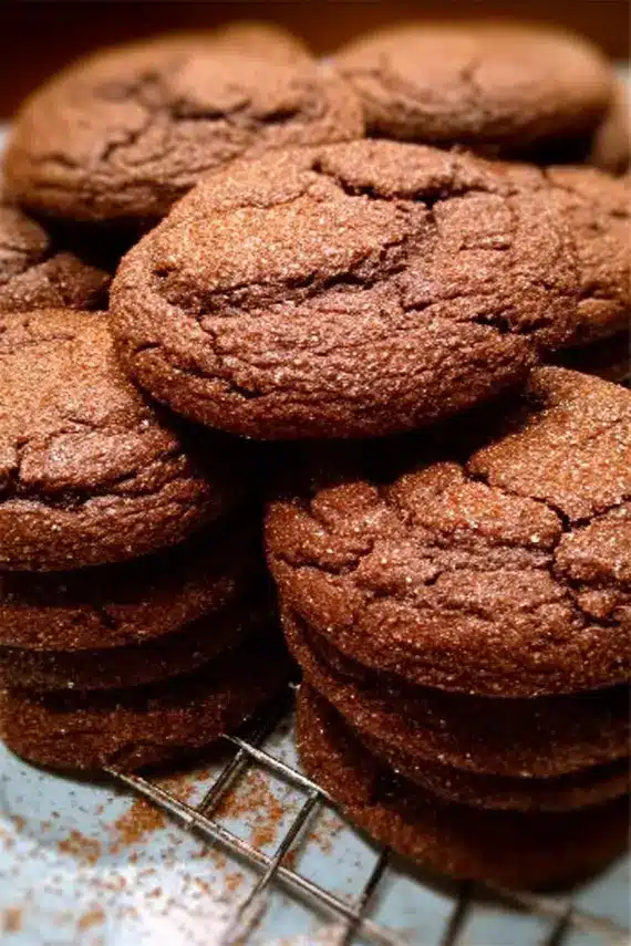 Chocolate snickerdoodle cookies stacked on a decorative plate