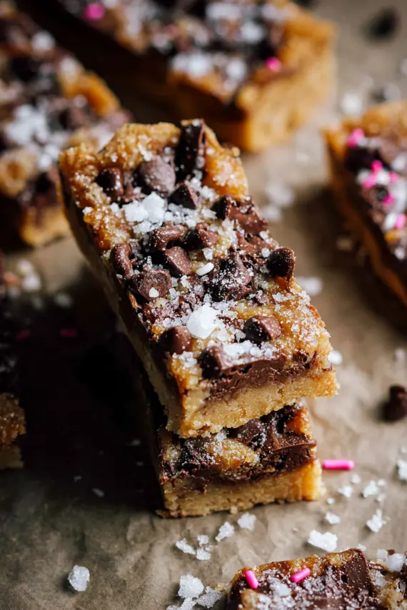 Cookie Butter Chocolate Bars on a white plate with sprinkles on top