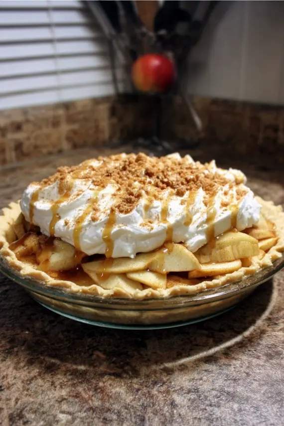 Close-up of creamy filling in apple pie with visible apple slices