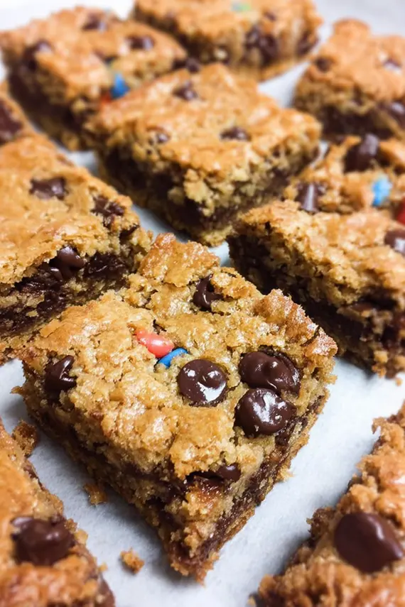 Close-up of flourless monster cookie bars showing their chewy texture