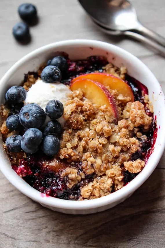 Freshly baked blueberry peach crumble in a baking dish
