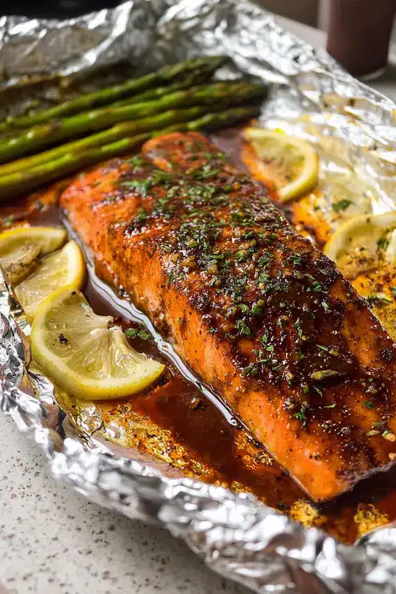 Beautifully plated maple glazed salmon served with roasted vegetables and fresh herbs