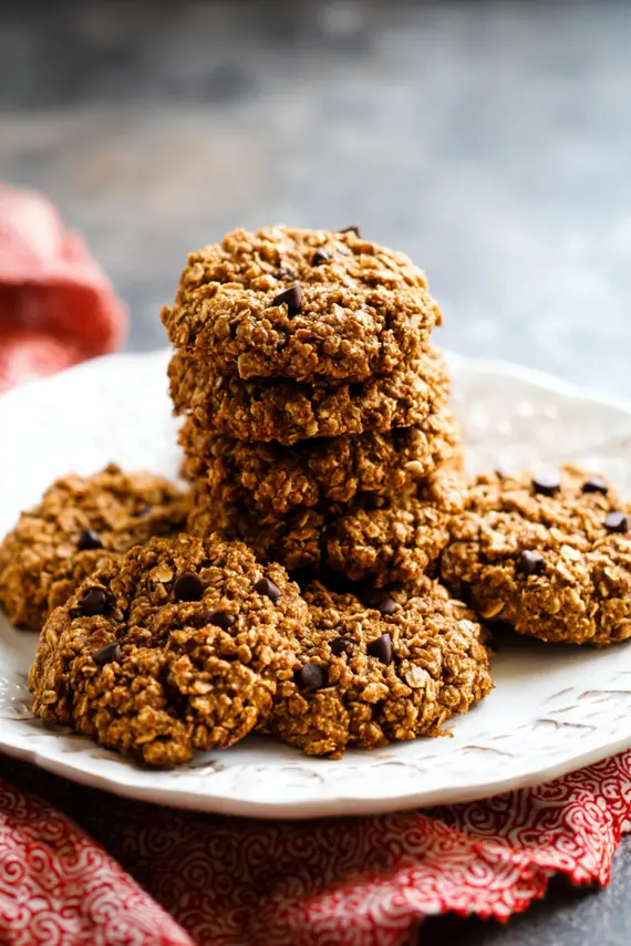 Freshly baked gluten free ginger oatmeal cookies cooling on a wire rack