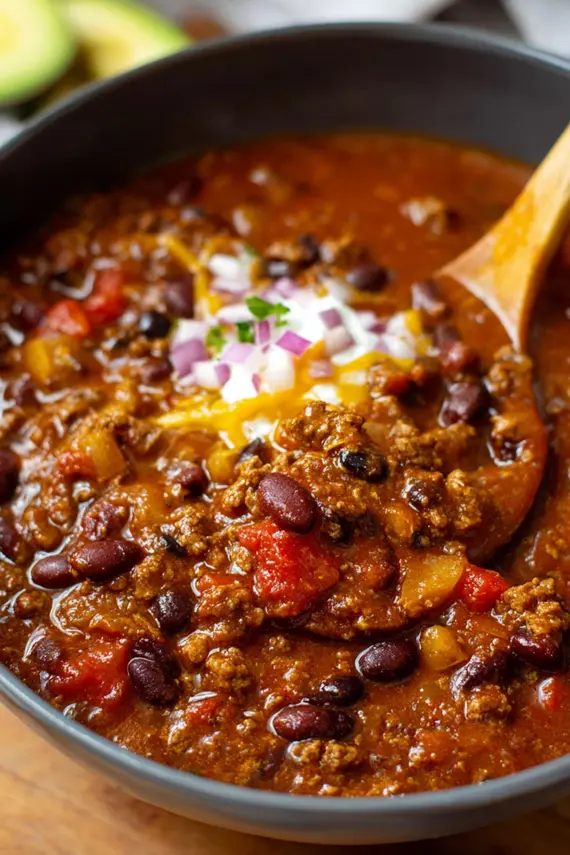Instant Pot Taco Ground Beef Chili in a bowl topped with cheese and sour cream