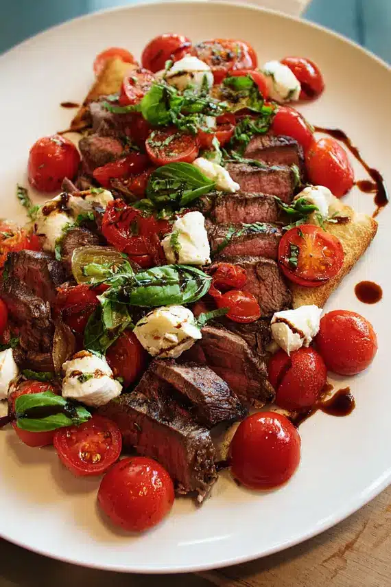 Italian salad with fresh ingredients including tomatoes, mozzarella, and basil leaves