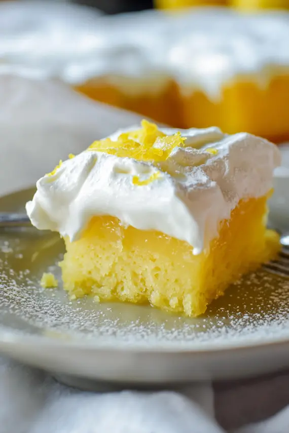 Frosted lemon jello cake with whipped cream topping