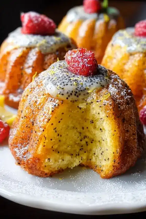 Mini lemon poppy seed bundt cakes with powdered sugar dusting