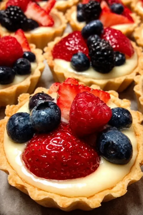 Close-up of golden mini tart crusts before filling