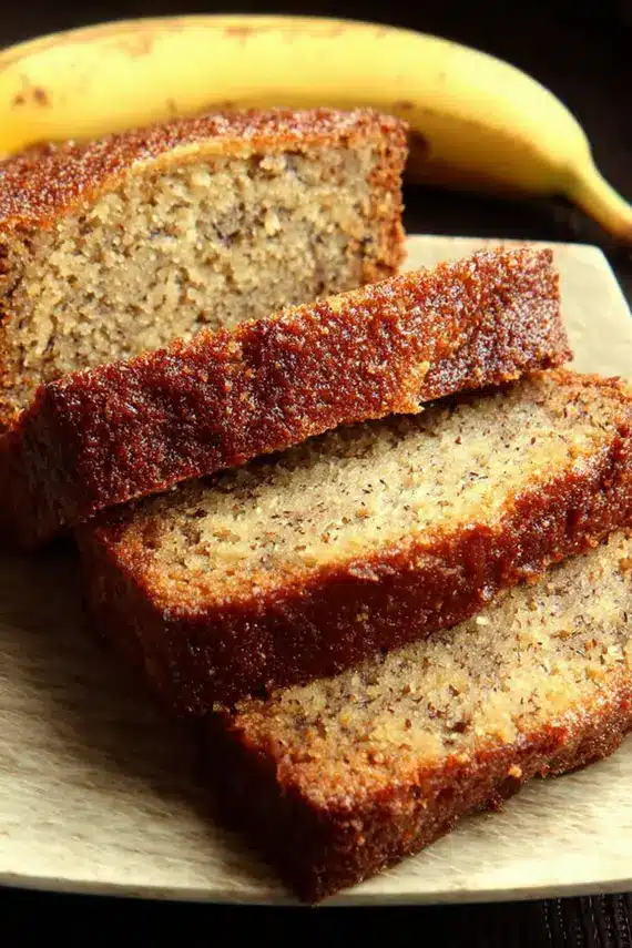 Decorated banana cake with whipped cream and fresh bananas