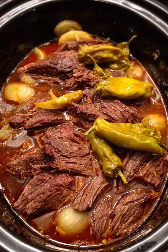 Slow Cooker Pepperoncini Beef served in a bowl with rich sauce