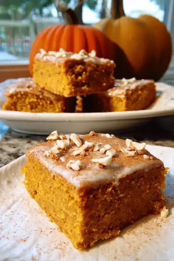 Freshly baked pumpkin sheet cake with cream cheese frosting