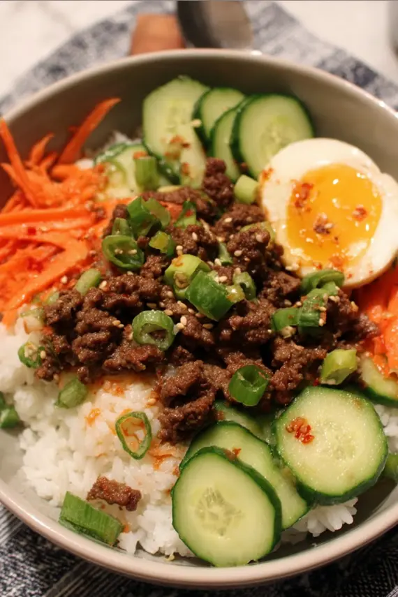 Beautifully arranged Korean beef rice bowl with colorful vegetables