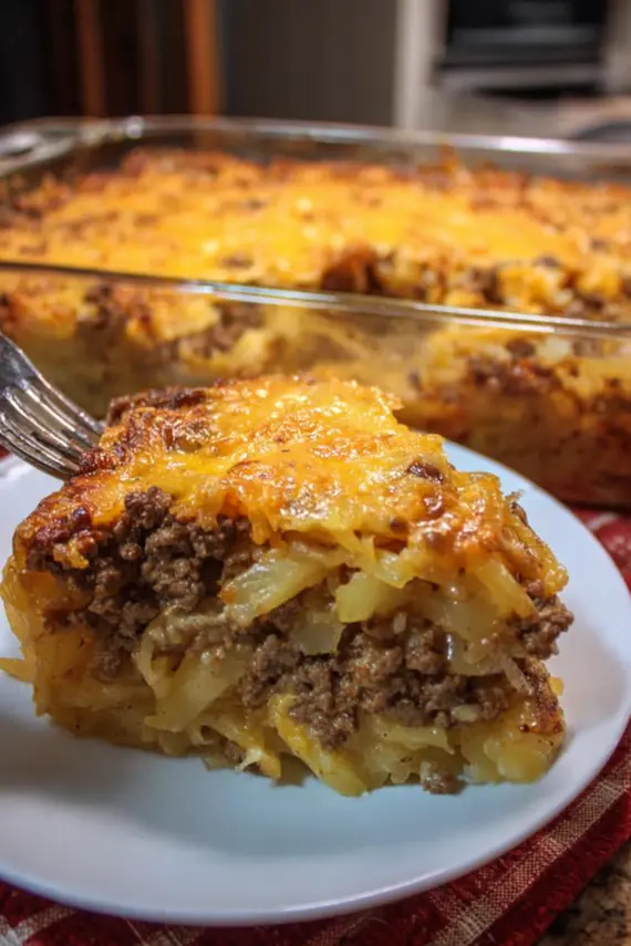 Beef Sauerkraut Pineapple Casserole with melted cheese topping in a baking dish