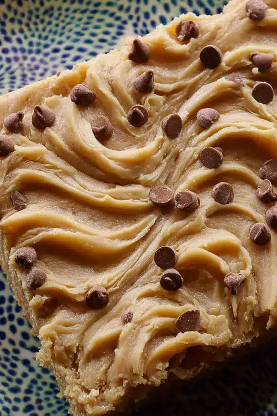 Freshly baked peanut butter sheet cake with creamy frosting