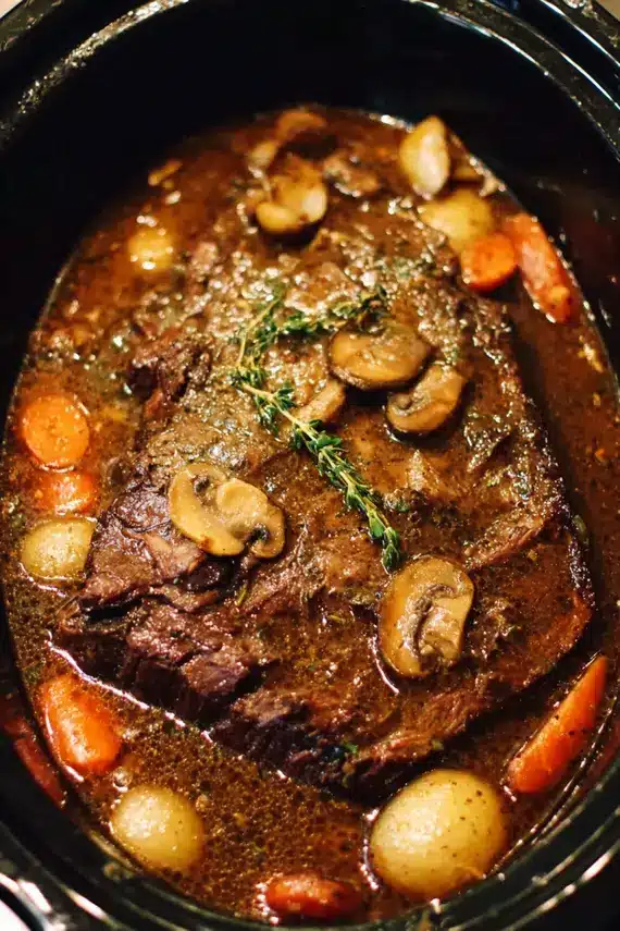 Slow Cooker Beef Roast with Mushroom Gravy served on a plate