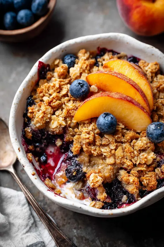 Blueberry peach crumble served with ice cream