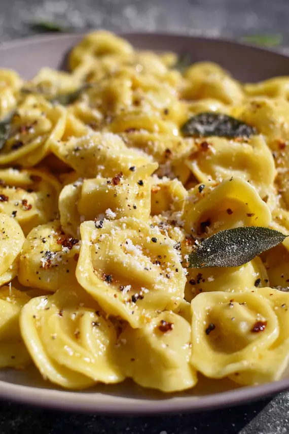 Parmesan Tortelli with Butter Sauce freshly prepared in a pan