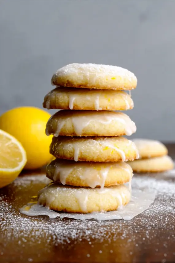 Sweet glazed lemon cookies with a shiny zesty lemon glaze drizzled on top