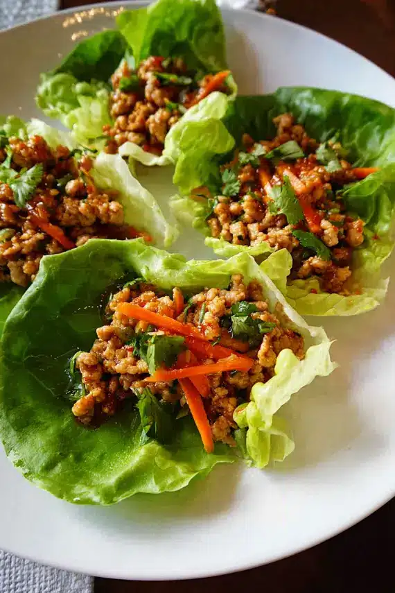Delicious Thai chili chicken lettuce wraps served on a platter ready to eat