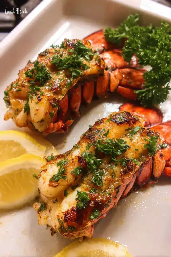 Perfectly cooked garlic butter lobster tails on a serving platter