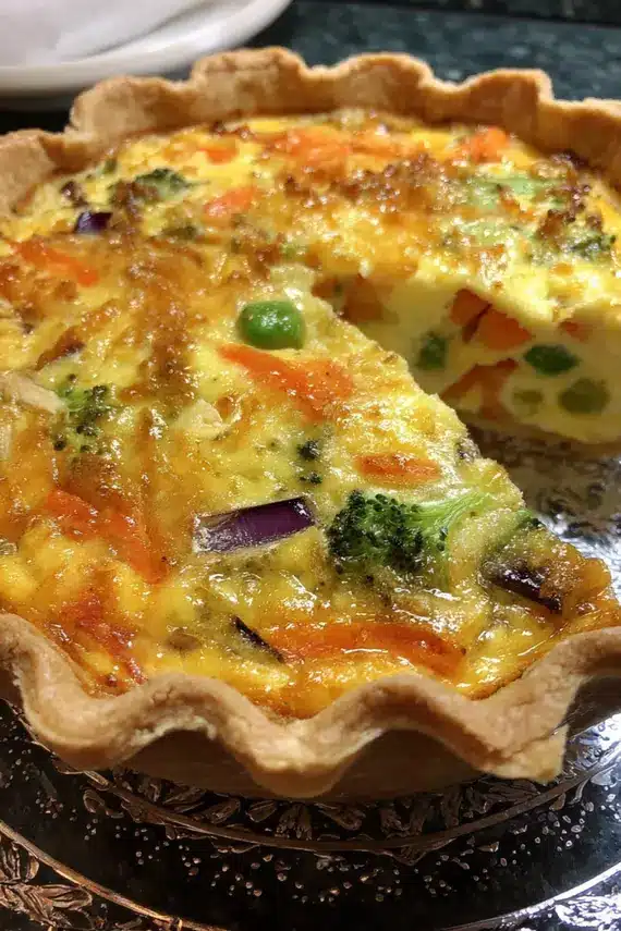 Mixed vegetable quiche served as part of a savory brunch spread